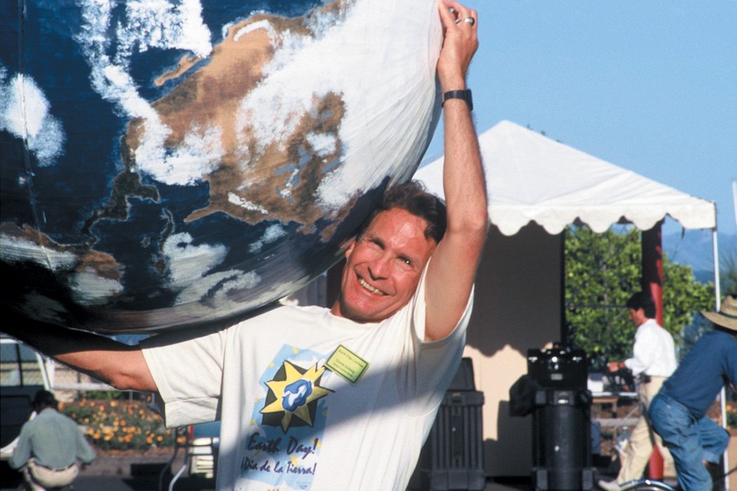  Santa Barbara environmental activist Charlie Eckberg holds a globe during the 1990 festival. 
