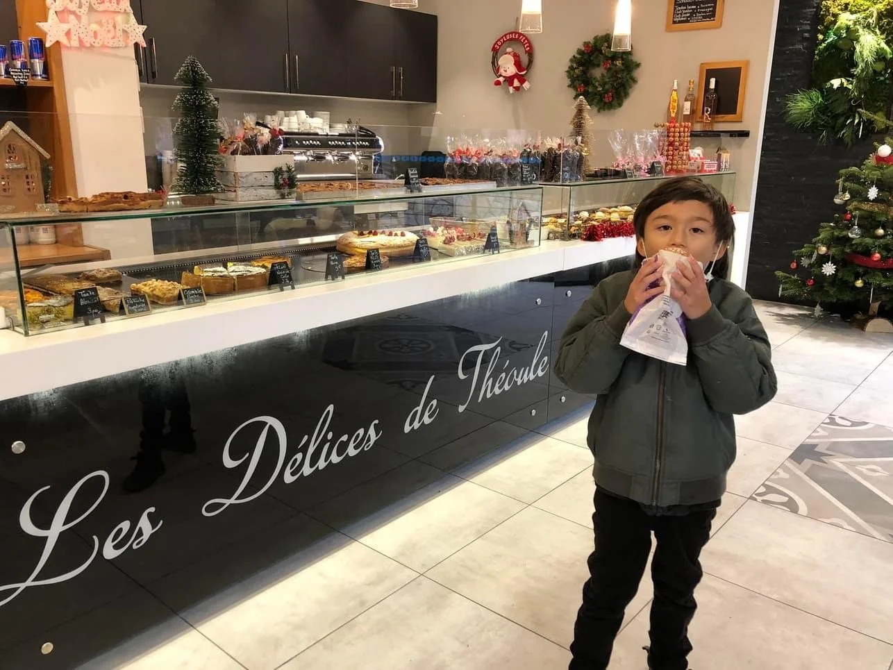 boy eating French pastry