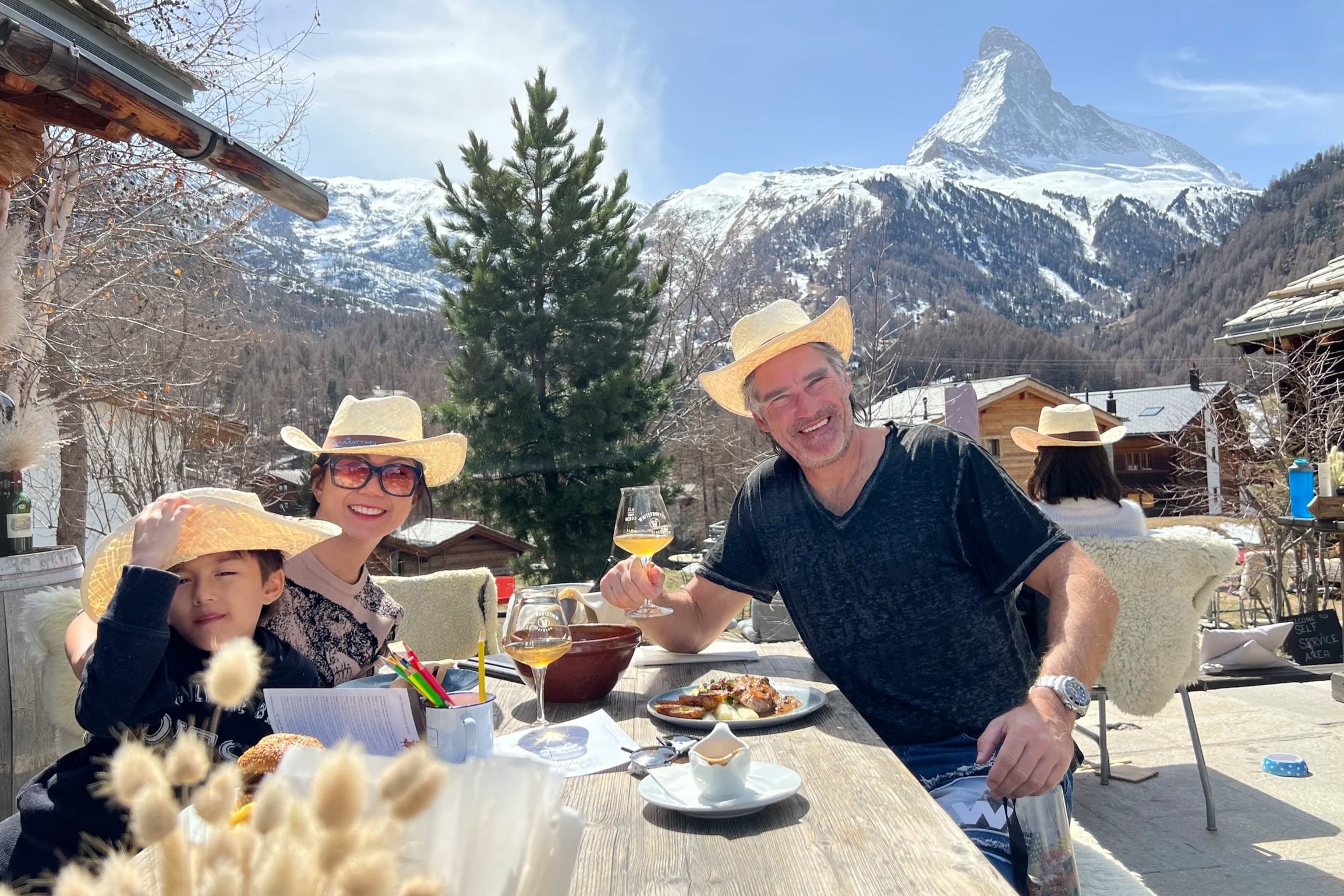 family in front of matterhorn in a restaurant