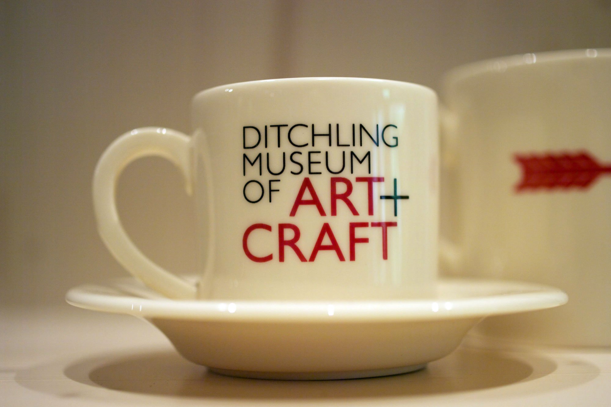  Ditchling Museum of Art + Craft: Bone china mug for Ditchling Museum of Art + Craft with lettering by Phil Baines after Eric Gill. 2013 