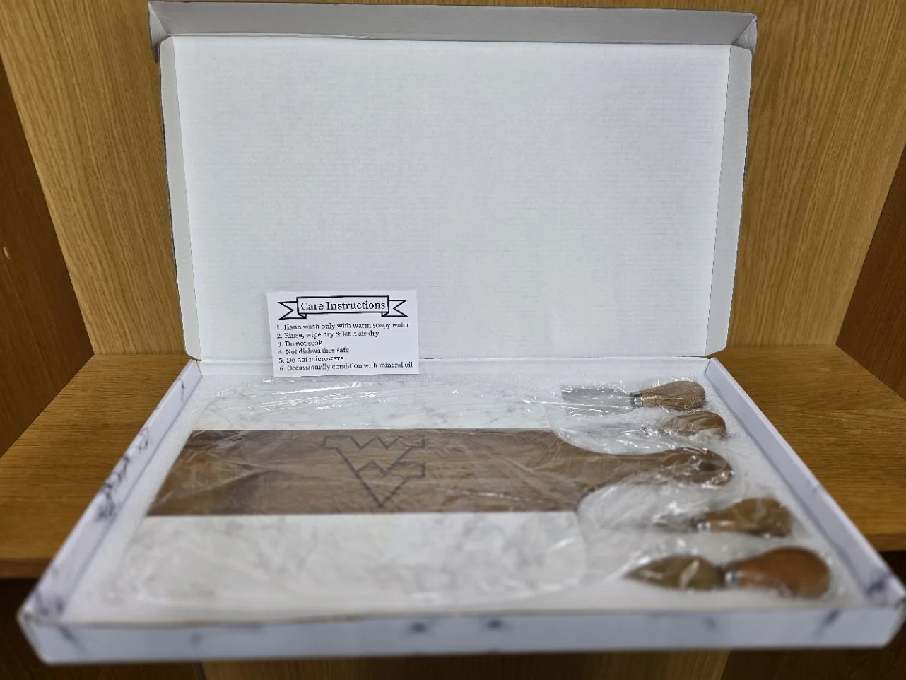 Marble and wood serving board with utensils