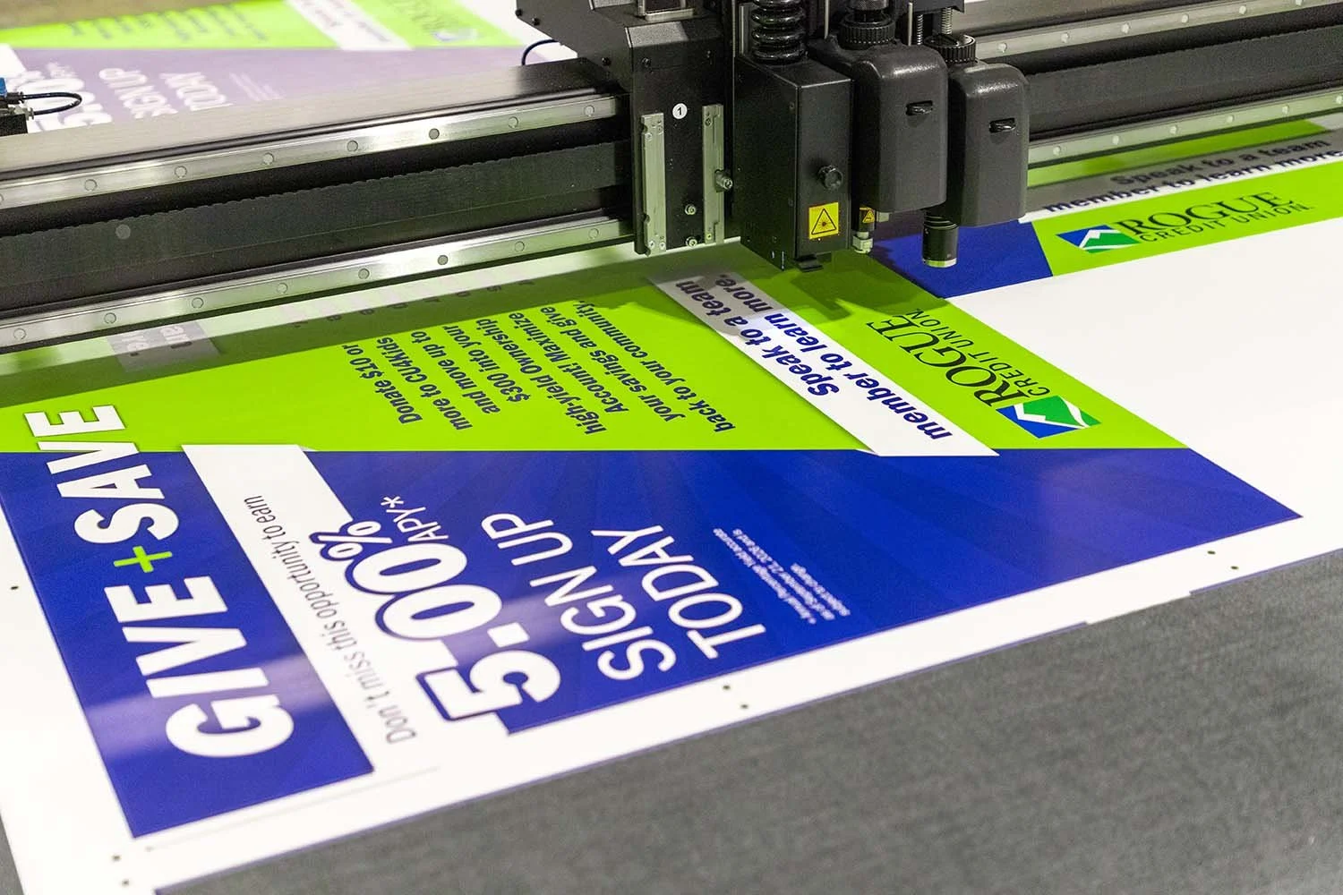 Rogue Credit Union Poster Cutting
