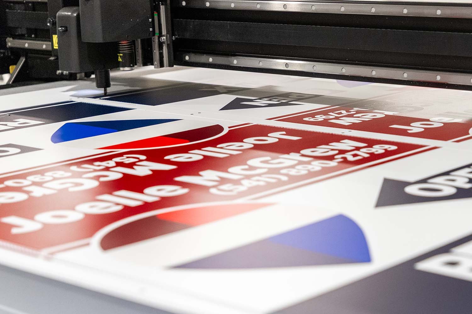 Custom Knife Cutting a Free Standing A Frame Sign for Remax Realty
