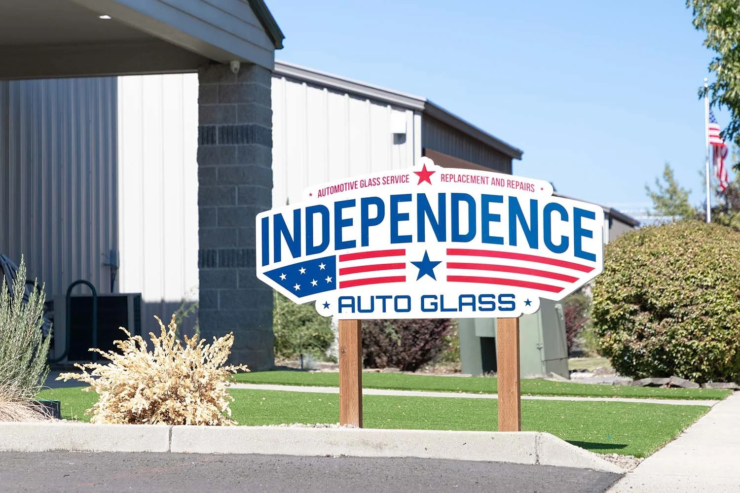 Router Cut Building Sign Mounted on Posts for Independence Auto Glass