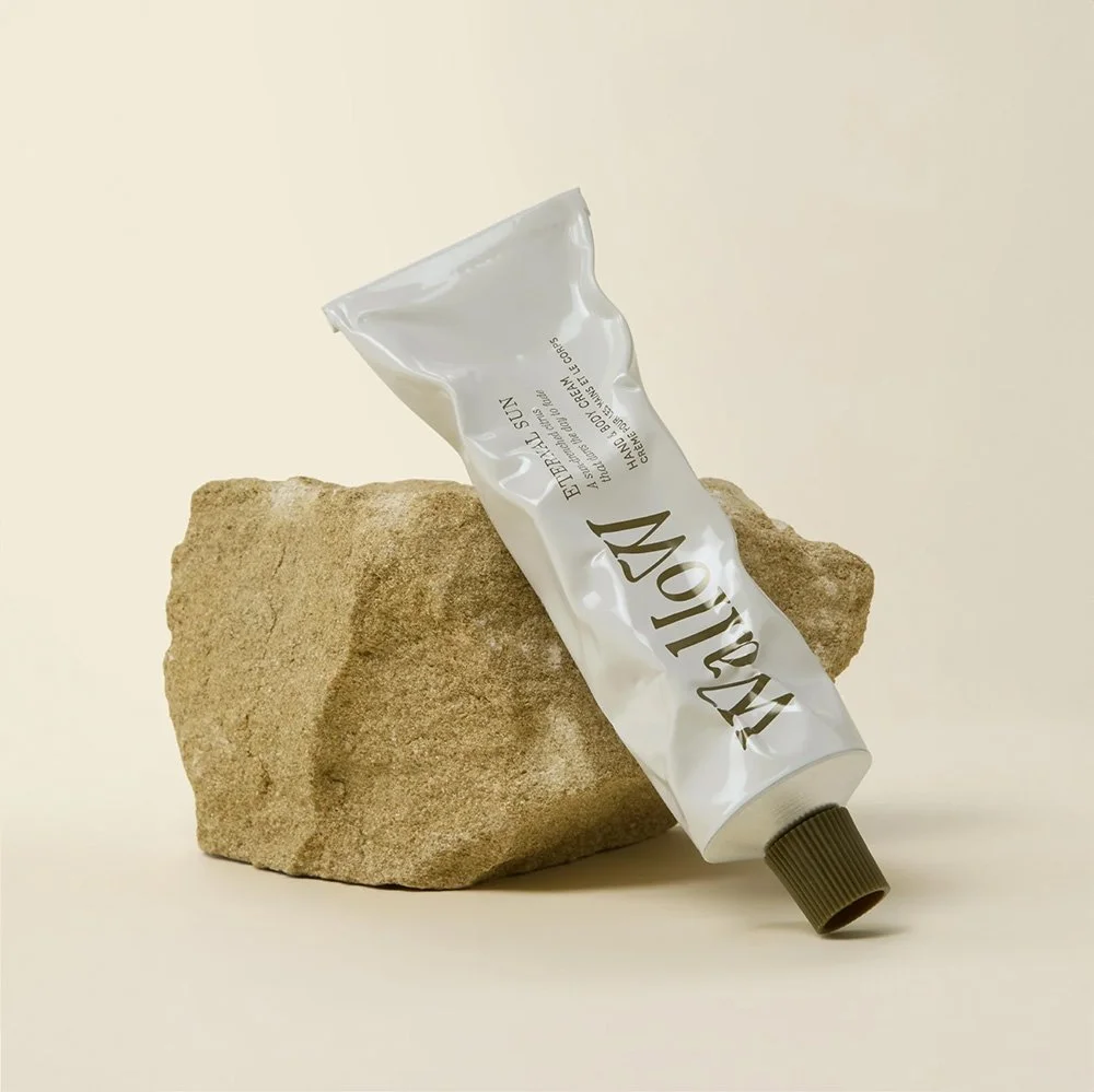 Packaging design for Wallow showcasing bottle and box design for products.