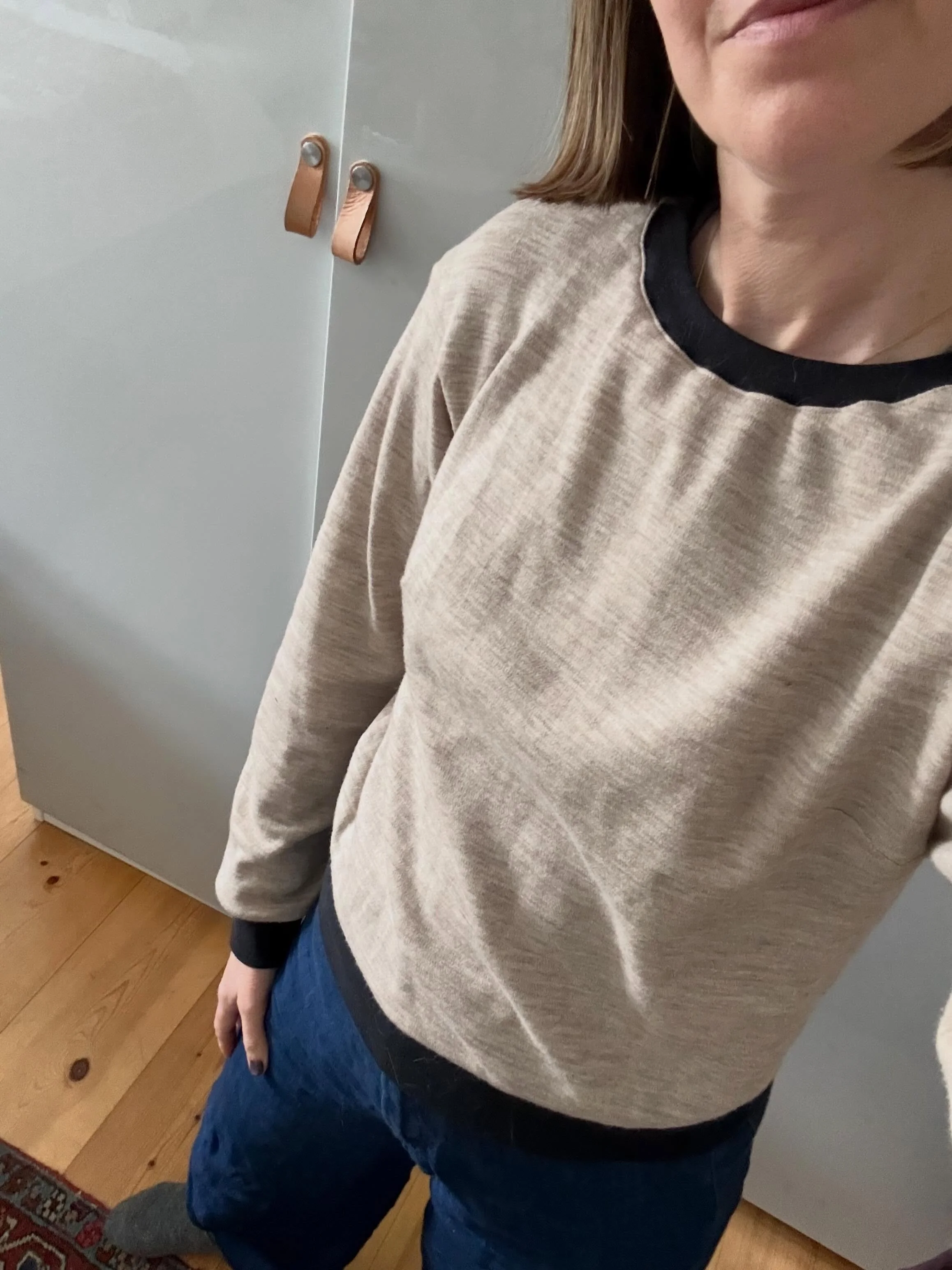 #memademay2026 day 8: Working at home with messy hair. I paired rtw jeans with a sweatshirt I made shockingly NOT from Merchant and Mills fabric. This is a remnant of designer deadstock merino knit from @1000stoff Berlin and pattern is @theassemblyli
