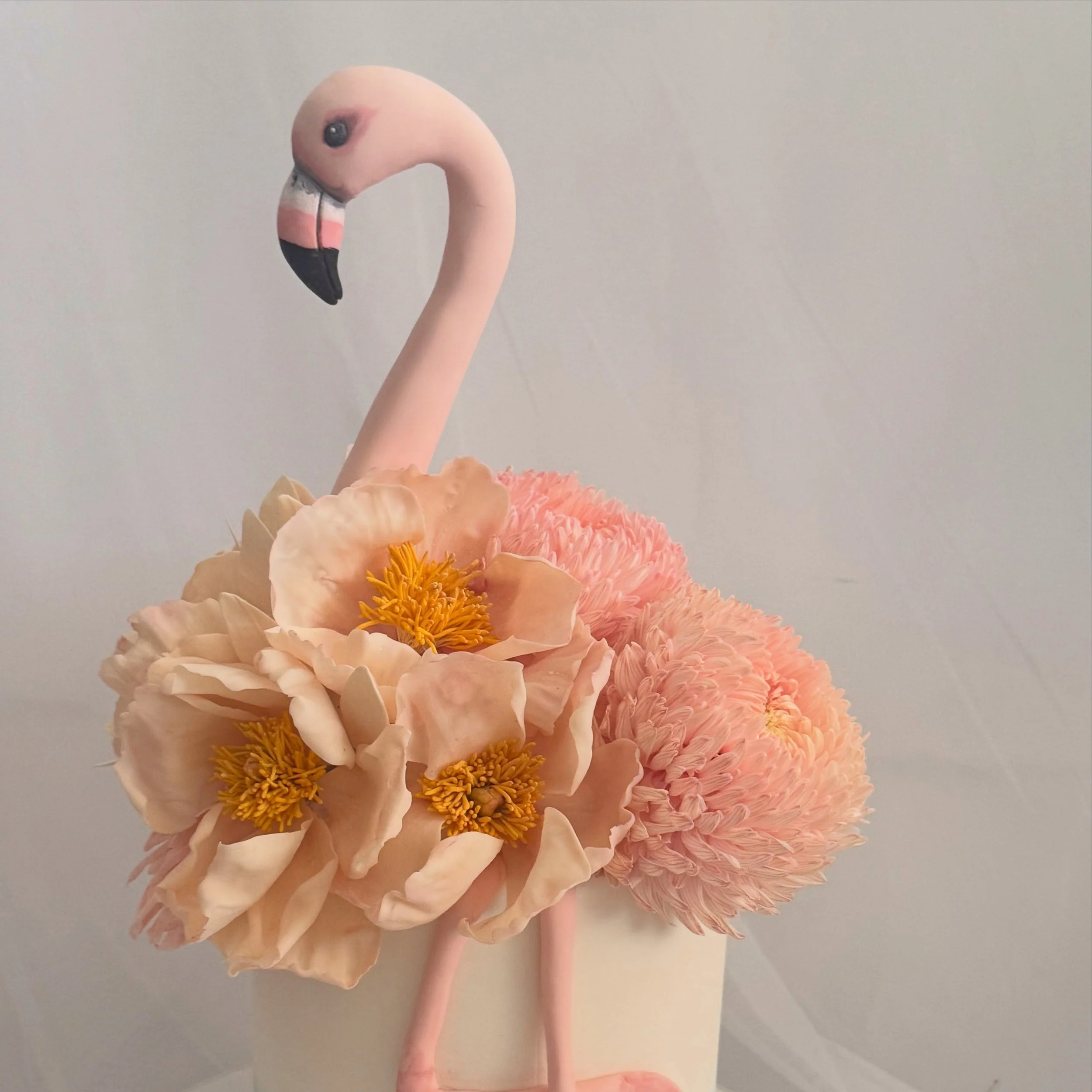 A mix of fresh and handmade flowers in delicate shell pink 🦩