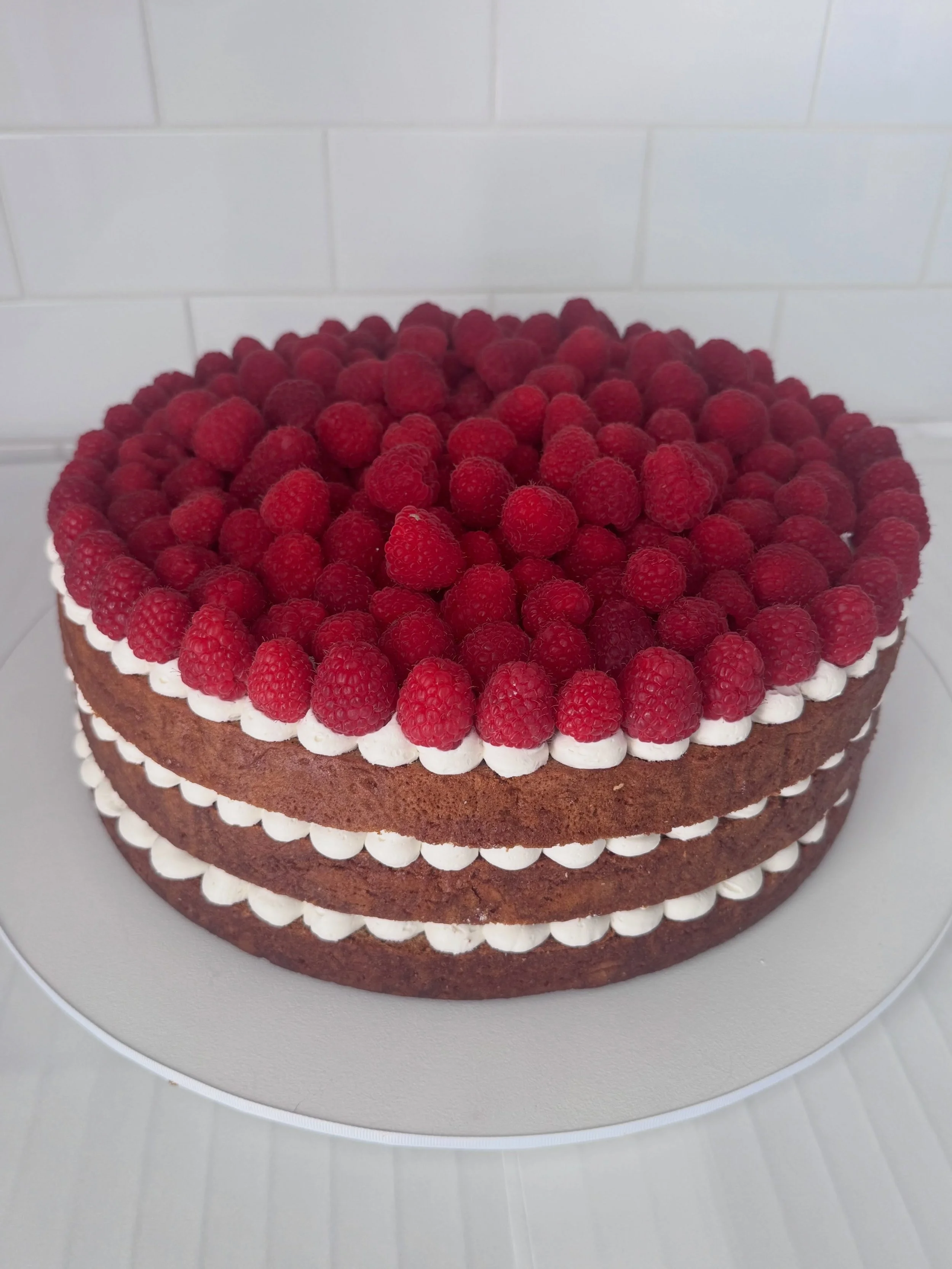 Classic raspberry cake 
This one has vanilla bean cr&egrave;me ganache, I use an amazing high quality vanilla bean, it&rsquo;s been really popular 
Optional fillings are lemon curd or raspberry preserve 
❤️🌿
Enquire for pricing on your size and to a