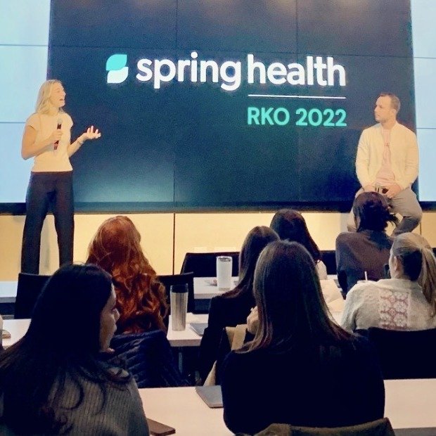 Dr. Natalie Christine speaking to an audience at a Spring Health event