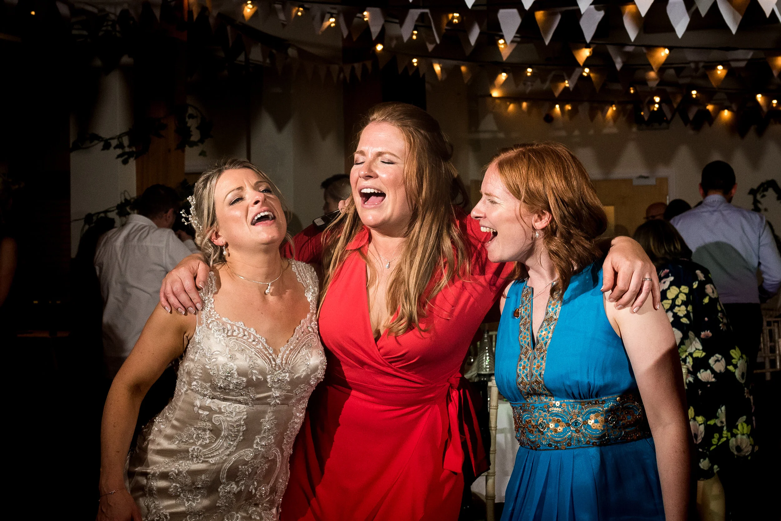 bride and sisters dancing, bride with bridesmaids singing, Harrogate wedding, Kettlesing 