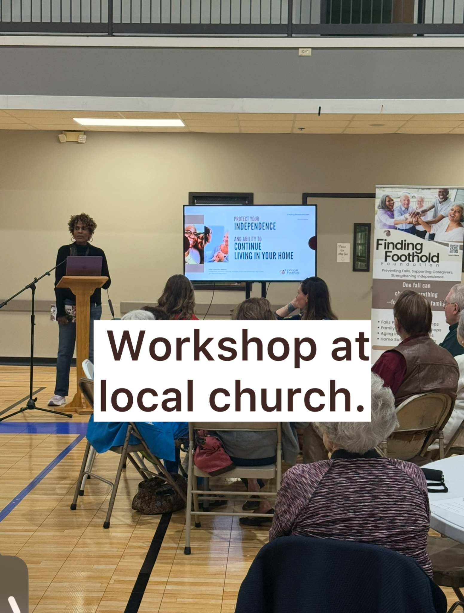 Consuela Marshall of Finding A Foothold Foundation speaking on fall prevention to business leaders at the Zachary Rotary Club with the club president standing beside her..