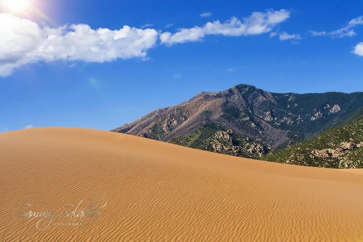 Desert dreams and mountain schemes. ✨ What an incredible view! #DunesAndMountains #NaturePerfection #TravelInspiration #BeautifulDestinations #ExploreMore #SunnyDays #PhotographyLovers #EpicViews #ColoradoAdventures #GetOutside# #Photography #photogr