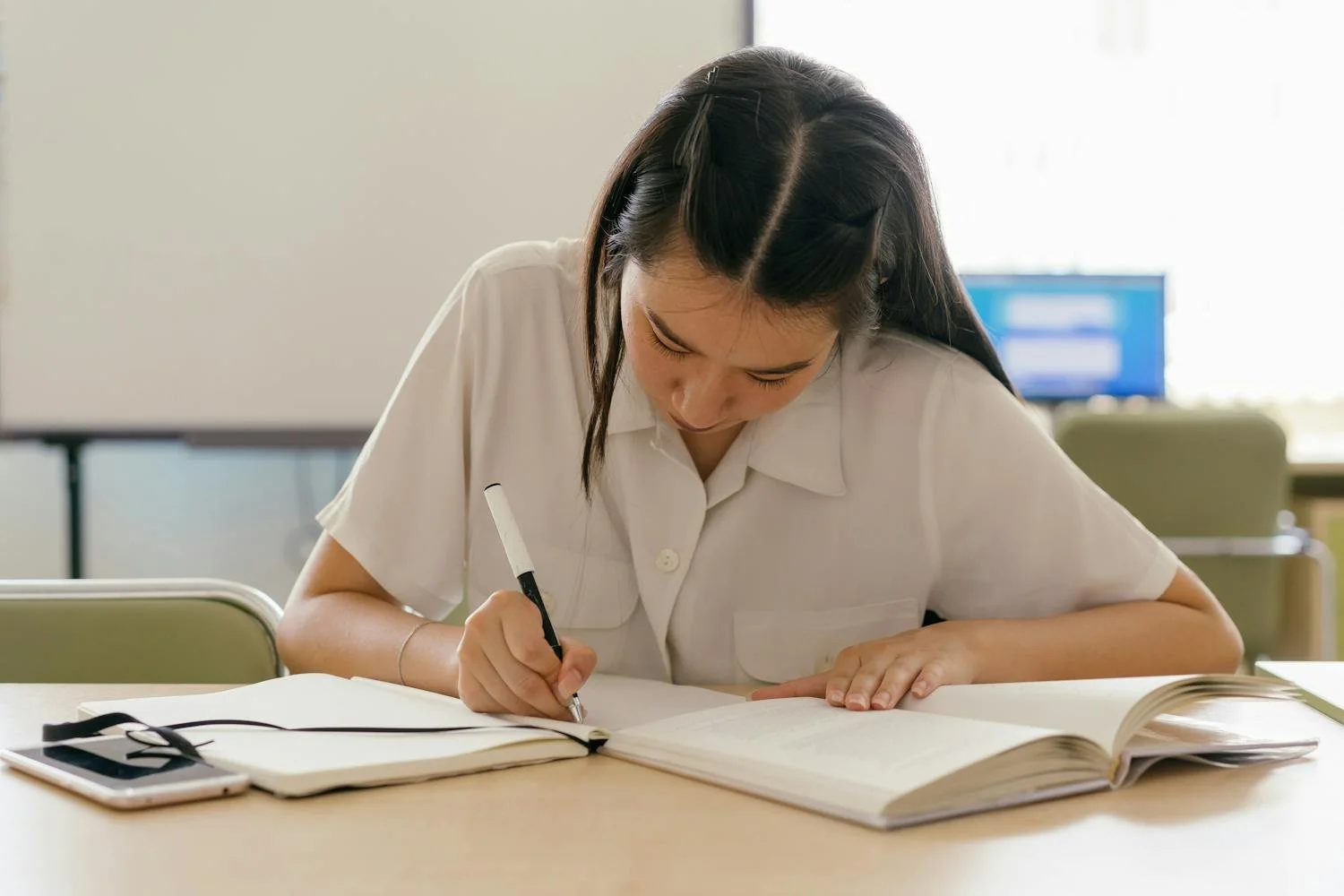 Student getting a headstart by previewing new subject material before school begins