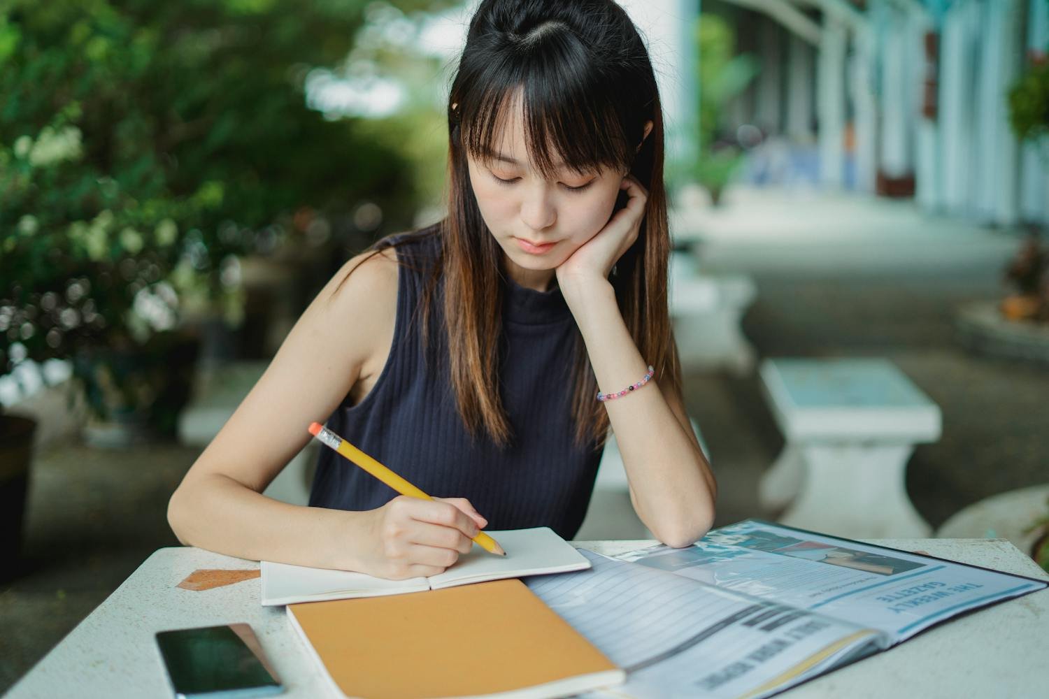 Student writing goals in planner or notebook
