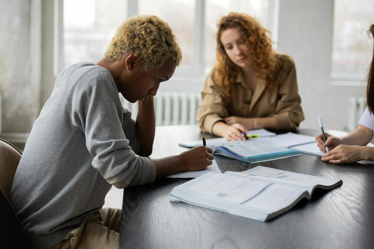 Tutor working with student on physics problem