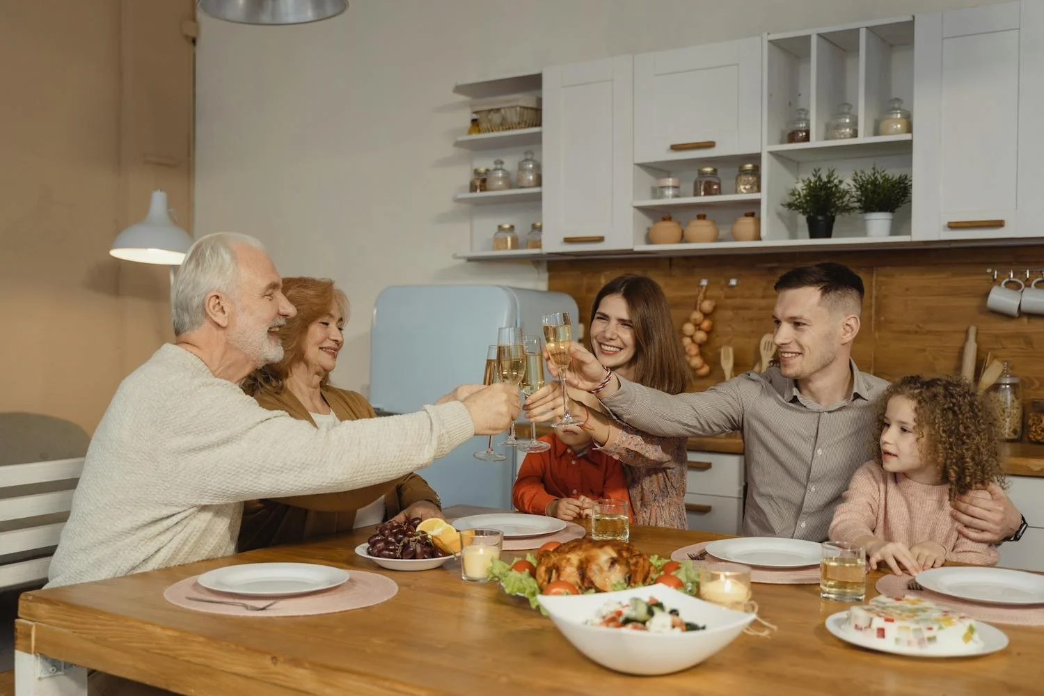 Family sharing a meal and laughing together during winter break