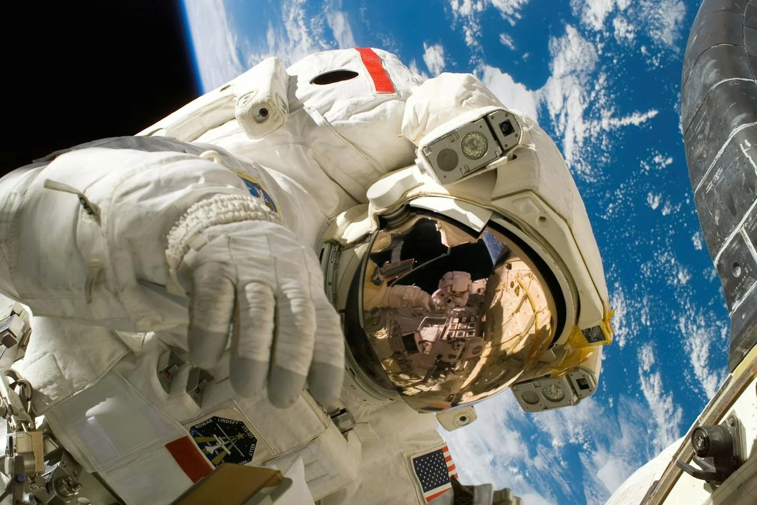 Astronaut floating in space beside gravity illustration