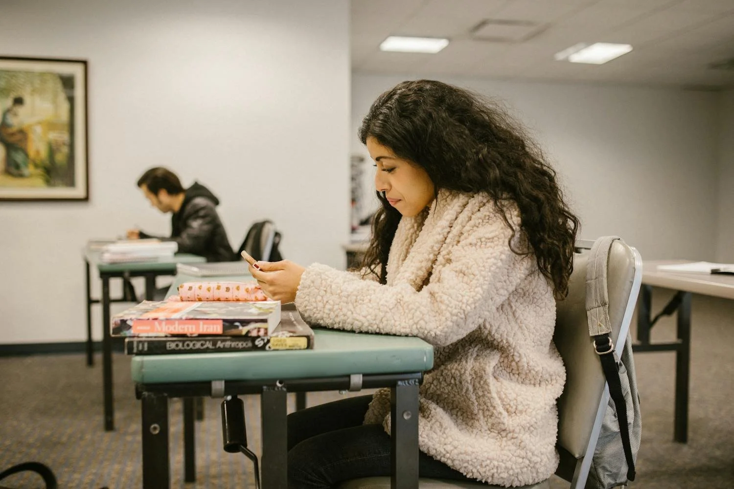 Student reviewing class schedule and college prep checklist