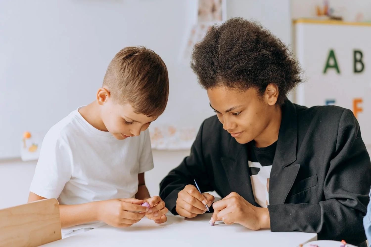 Student with dyslexia learning confidently with teacher support