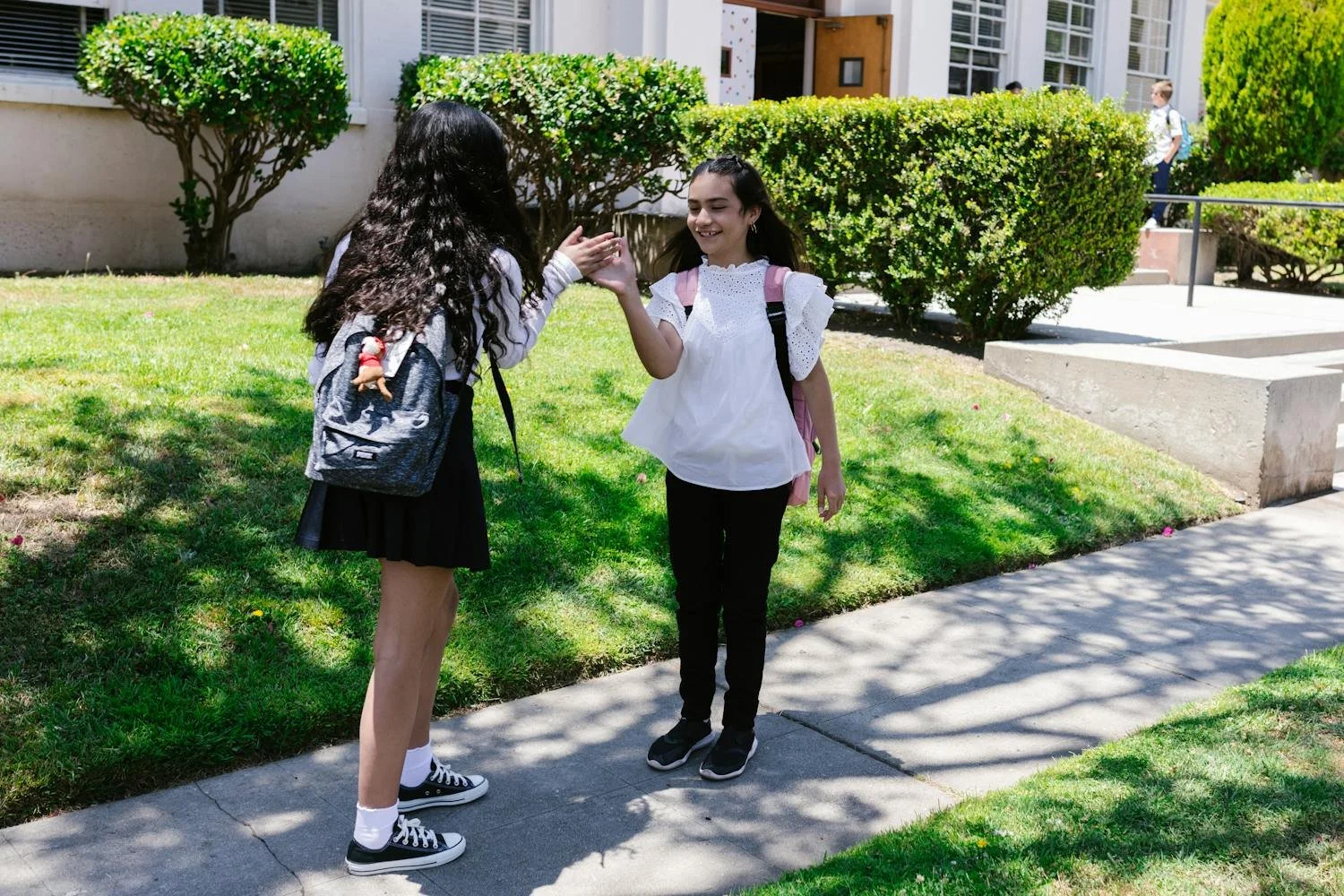 Student walking into high school campus for first day
