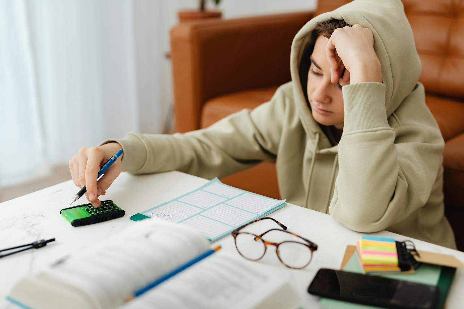 Student solving ACT geometry problems with calculator