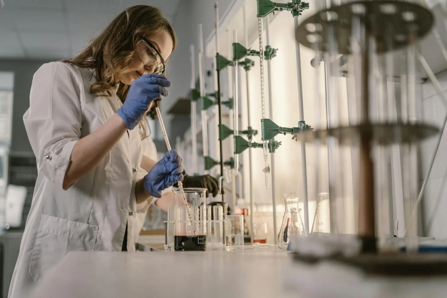 Student conducting Chemistry experiment in laboratory