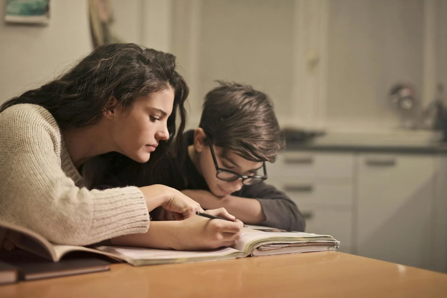 Tutor helping student with dyslexia improve reading confidence