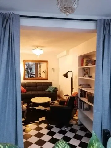 The livingroom has curtains for privacy if someone wants to sleep there