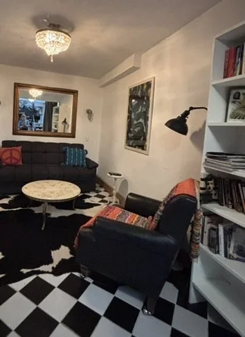 The livingroom has a big TV, a full bath, and curtains that close to make it another bedroom for anyone who doesn't like to use stairs.