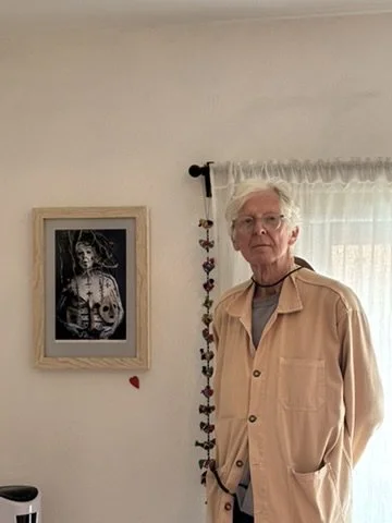 Artist Edward Swift with a portrait of him by local photographer Russell Monk