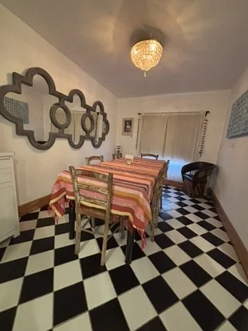 Dining room with painting on the right by Edward Swift