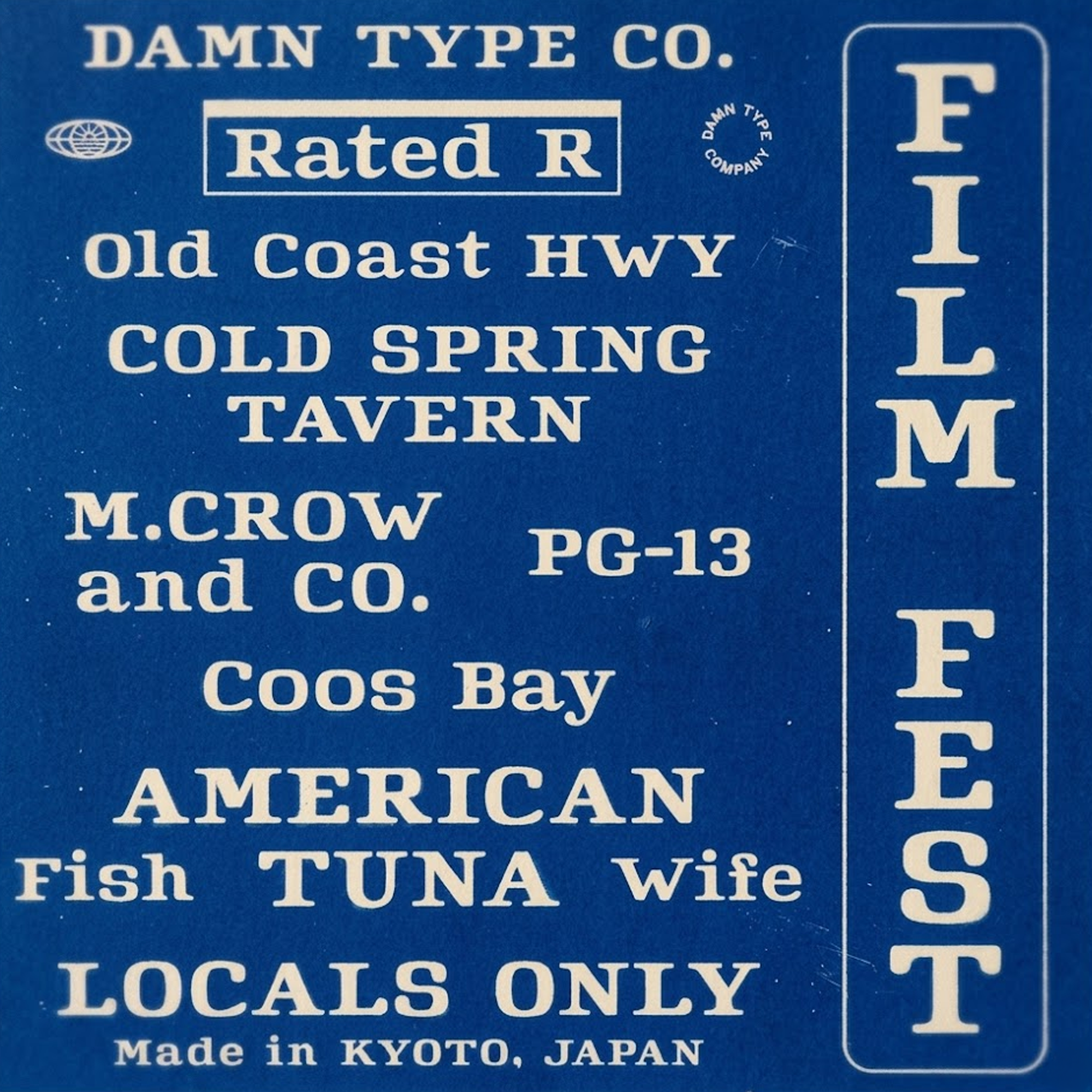 Mid-century serif by Damn Type Co. White lettering on deep blue with film grain. Features 'Cold Spring Tavern' & vertical 'Film Fest' tag. Heritage cinematic style.