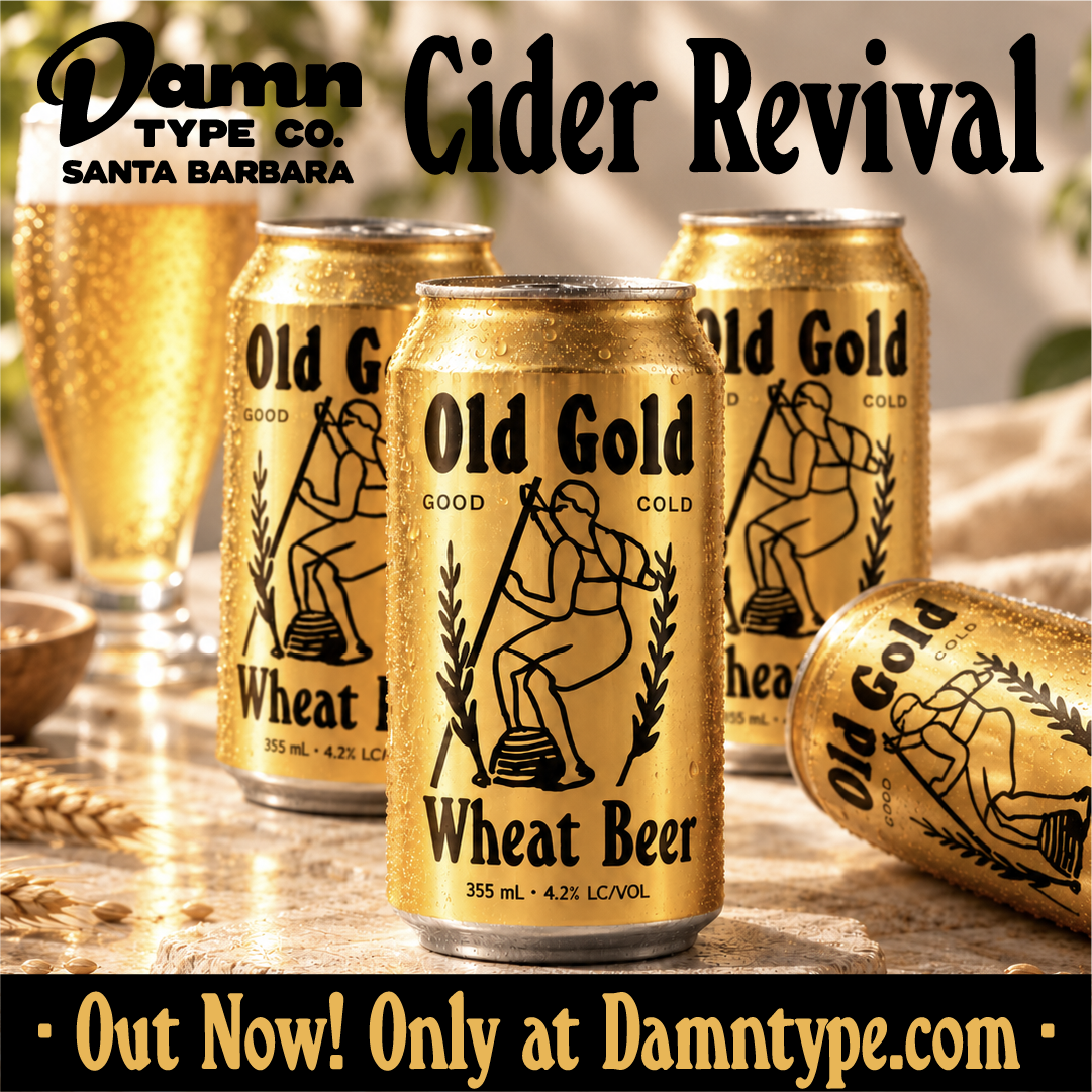 Gold Old Gold Wheat Beer cans featuring black Cider Revival lettering and a vintage figure illustration, arranged on a sunlit table with condensation.