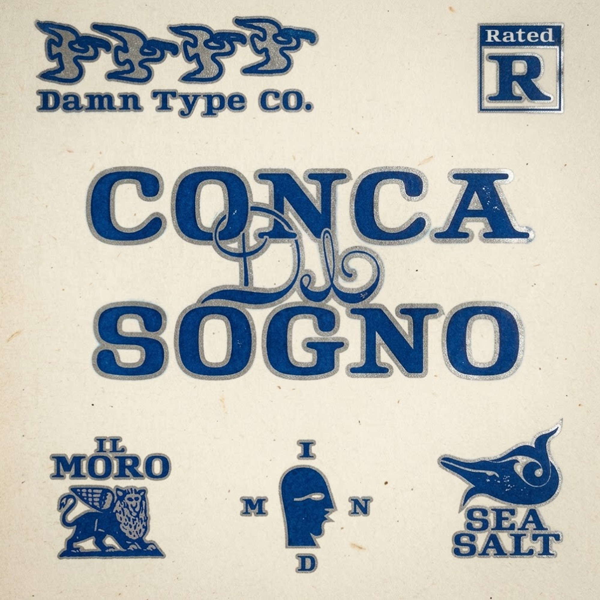 Rated R font specimen with blue lettering on cream paper. Features the Conca Di Sogno layout and nautical logos with a soft-focus film look and low-contrast bloom.