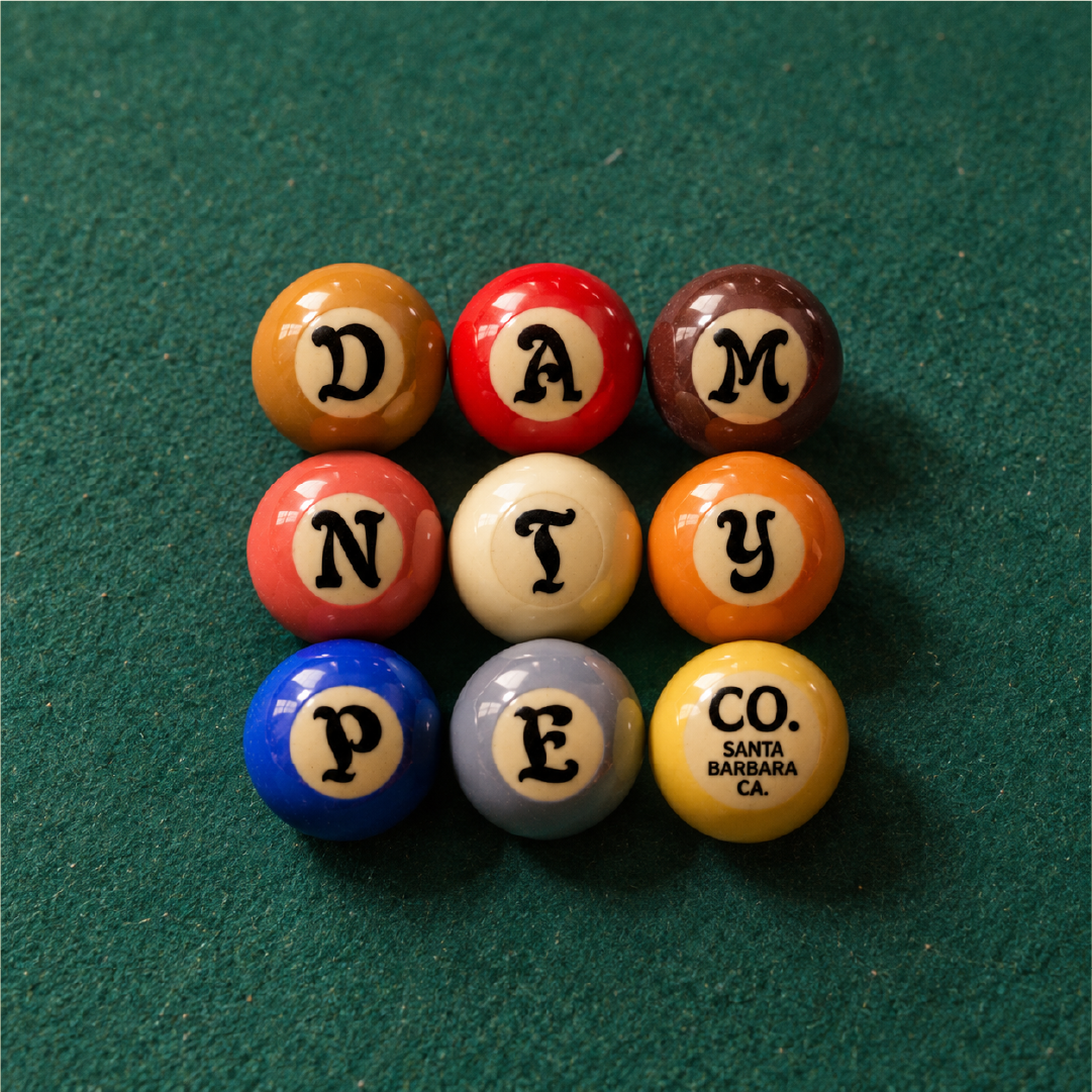 Freak Title font specimen by Damn Type Co., featuring colorful billiard balls arranged to spell “Damn Type Co.” on a green pool table.