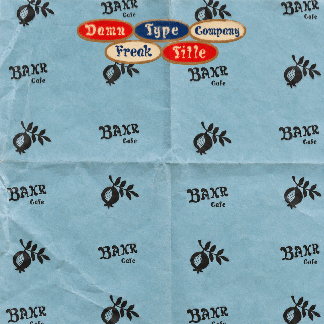 Freak Title font specimen by Damn Type Co., mocked up as vintage blue café wrapping paper with repeating BAKR Cafe logos, fruit illustrations, and colorful Freak Title labels.