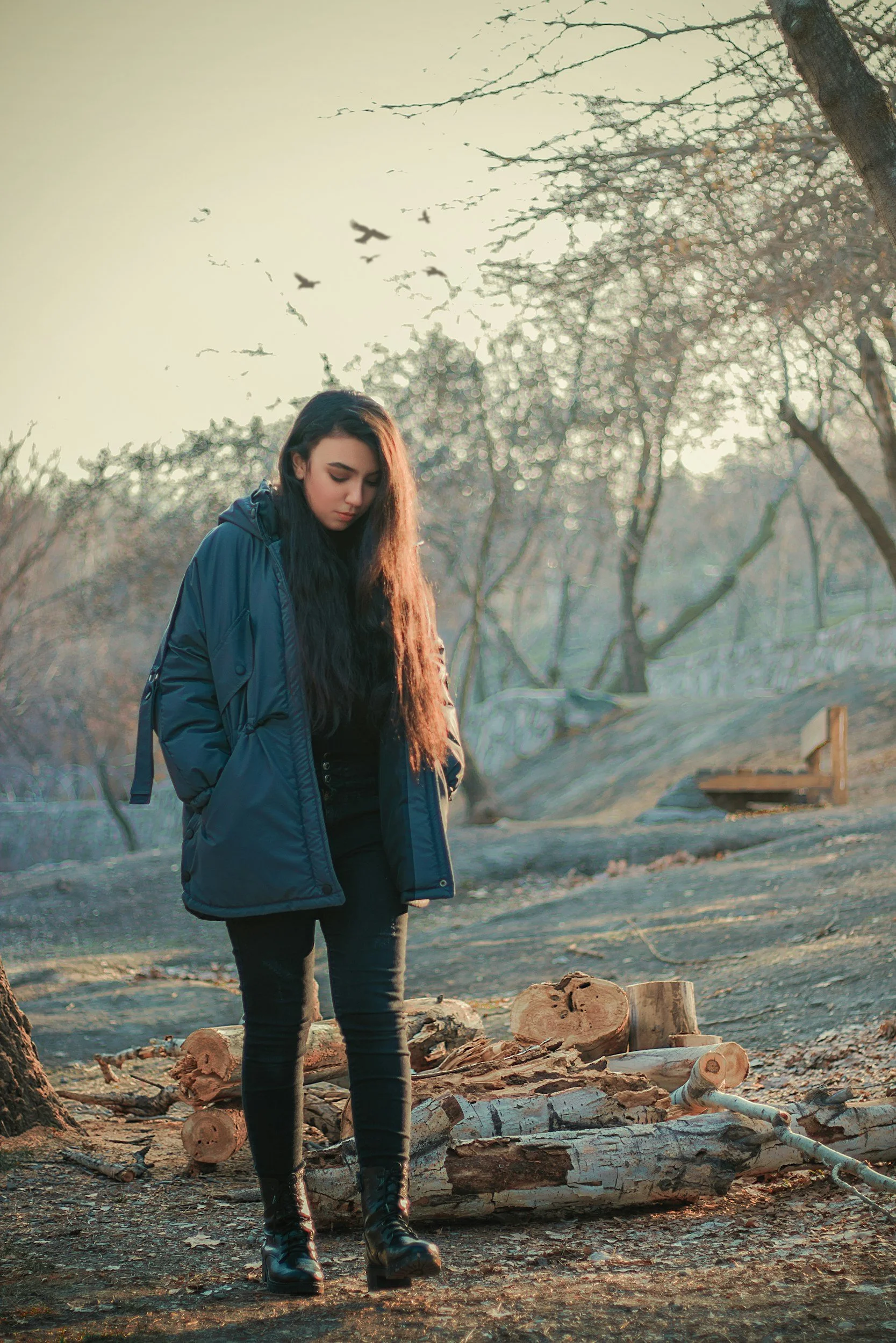 Woman walking outside wearing a coat walking past a pile of wood. Begin to heal from avoidant attachment caused by childhood trauma with a trauma therapist in Sugar Land, TX.