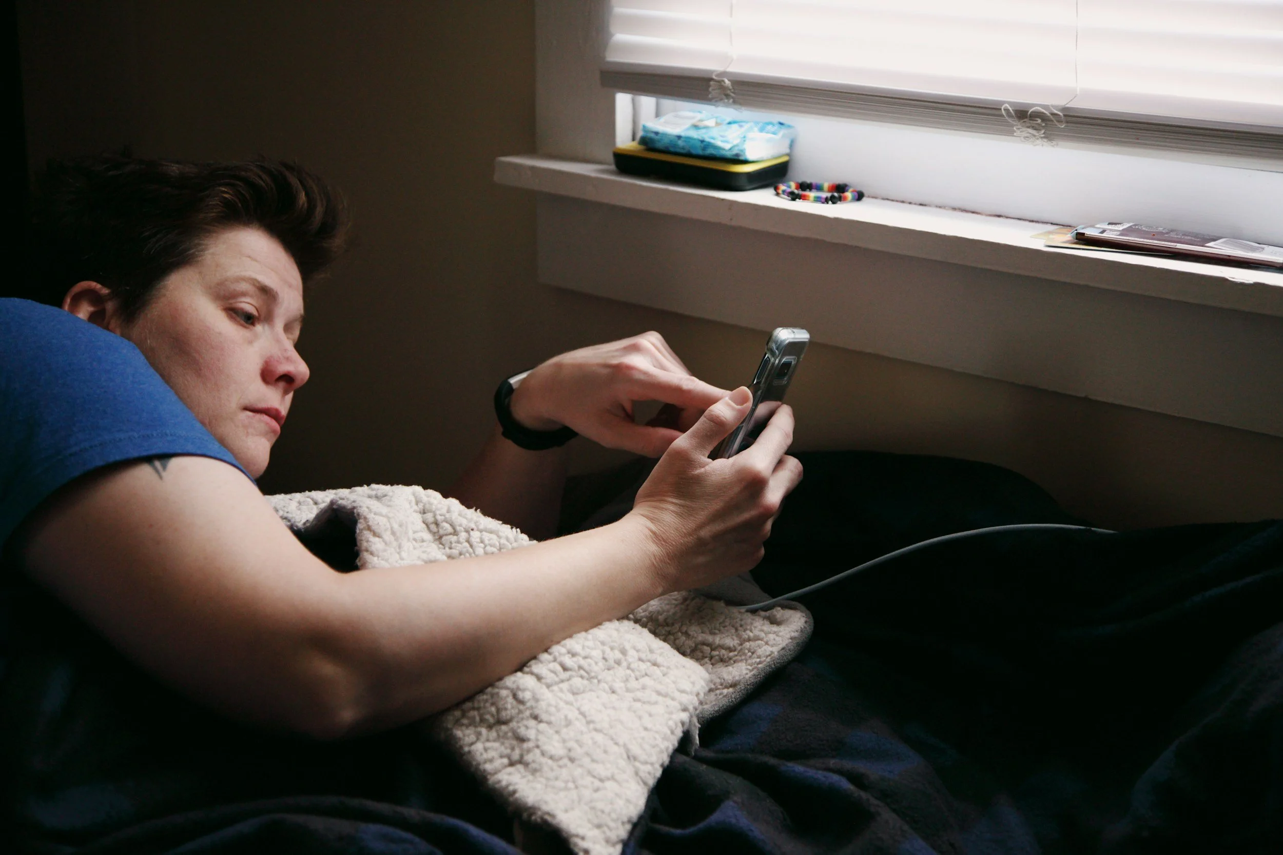 woman confused and alone wondering what do do after finding her husband has betrayed her with a secret account