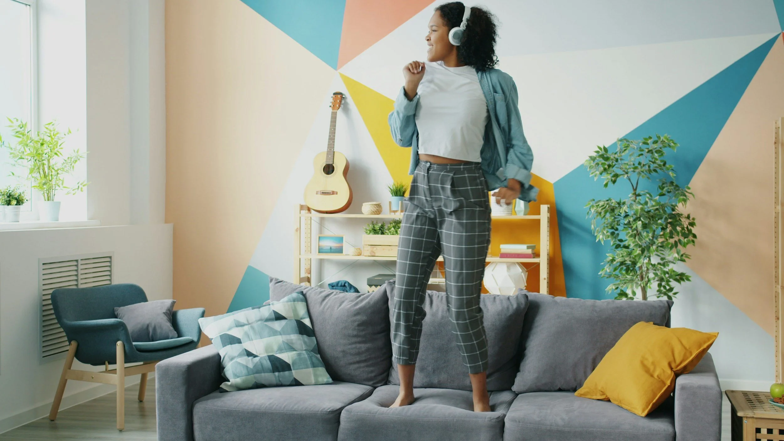 woman dancing to relieve her stress to help her overcome her over-functioning at work