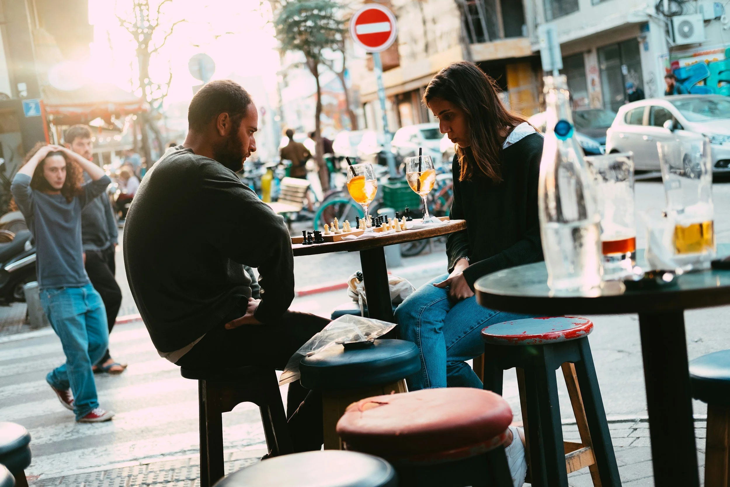 man and woman suffering from the stress put on the relationship because of the anxious attachment style one person has and looking for help through couples counseling