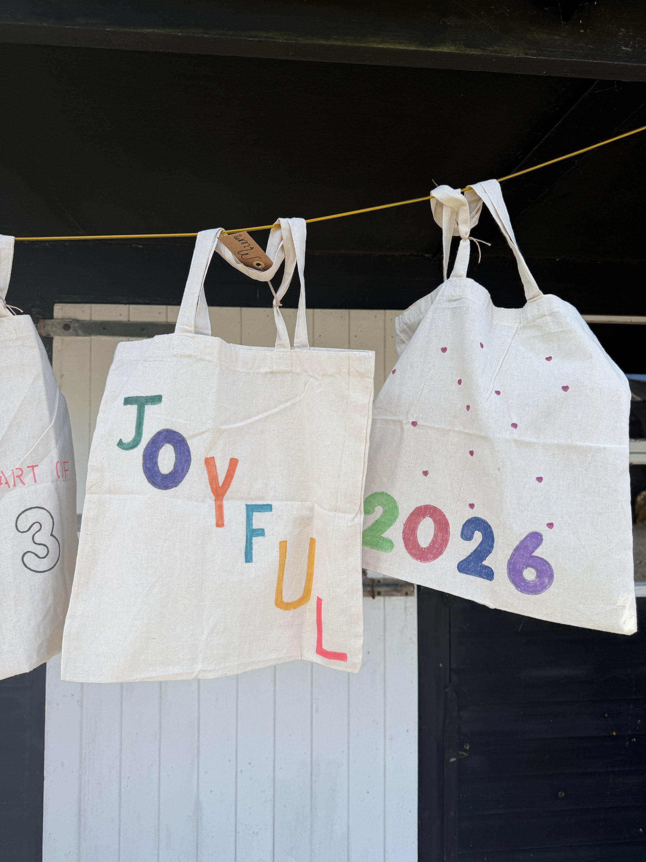 Hand painted bags from our 2026 retreat