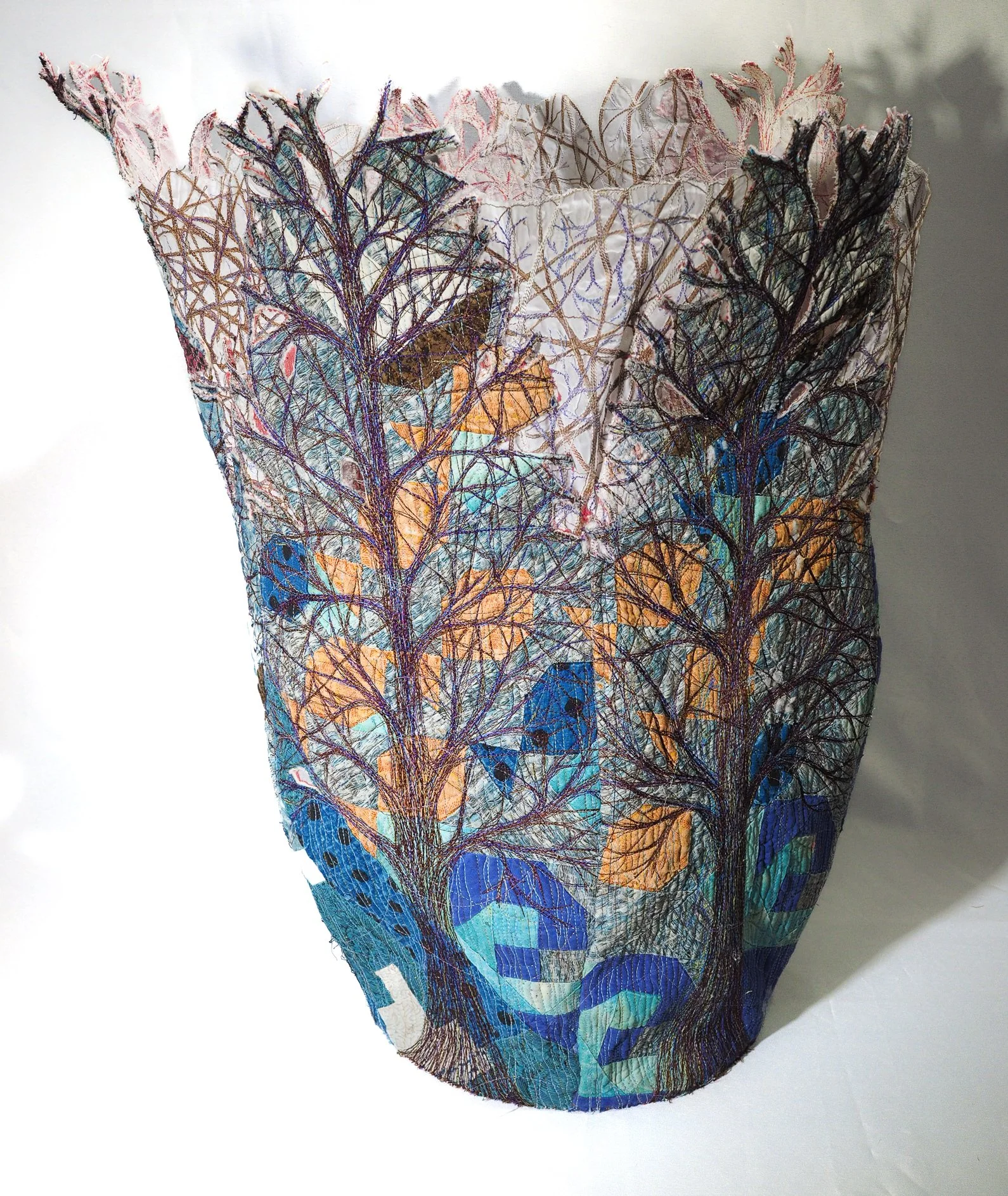 Breaking Boundaries (SAQA Virtual Gallery)
The concept of the art quilt has undergone a dynamic redefinition, liberating it from traditional constraints and inviting exploration into diverse forms of layered and stitched structures, in two or three d