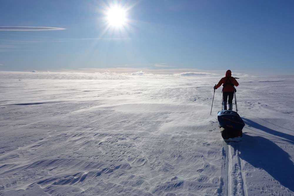 Maddy pulling a pulk (sled) across the Arctic (Finnmark Plateau, Norway)