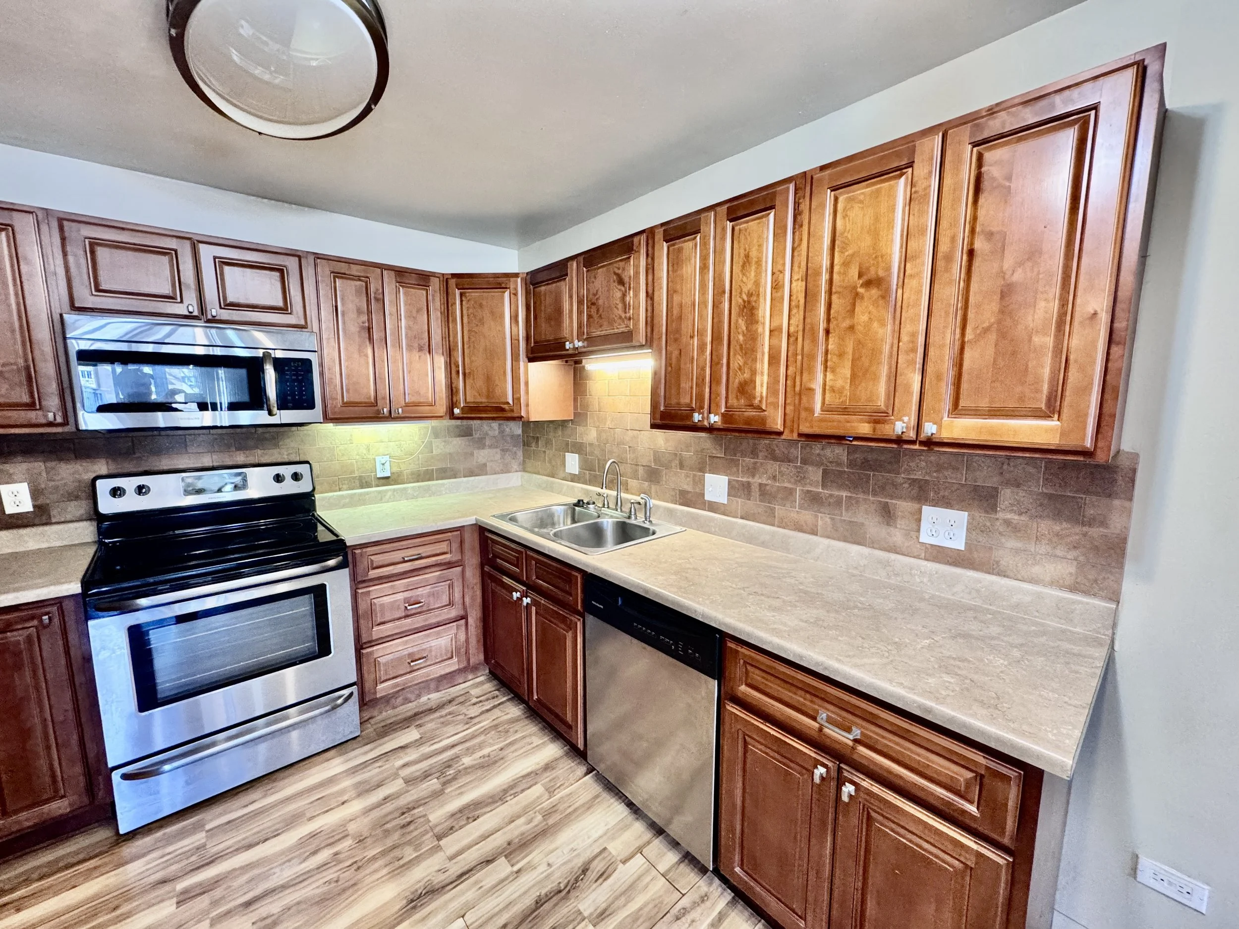 Kitchen with wood cabinets