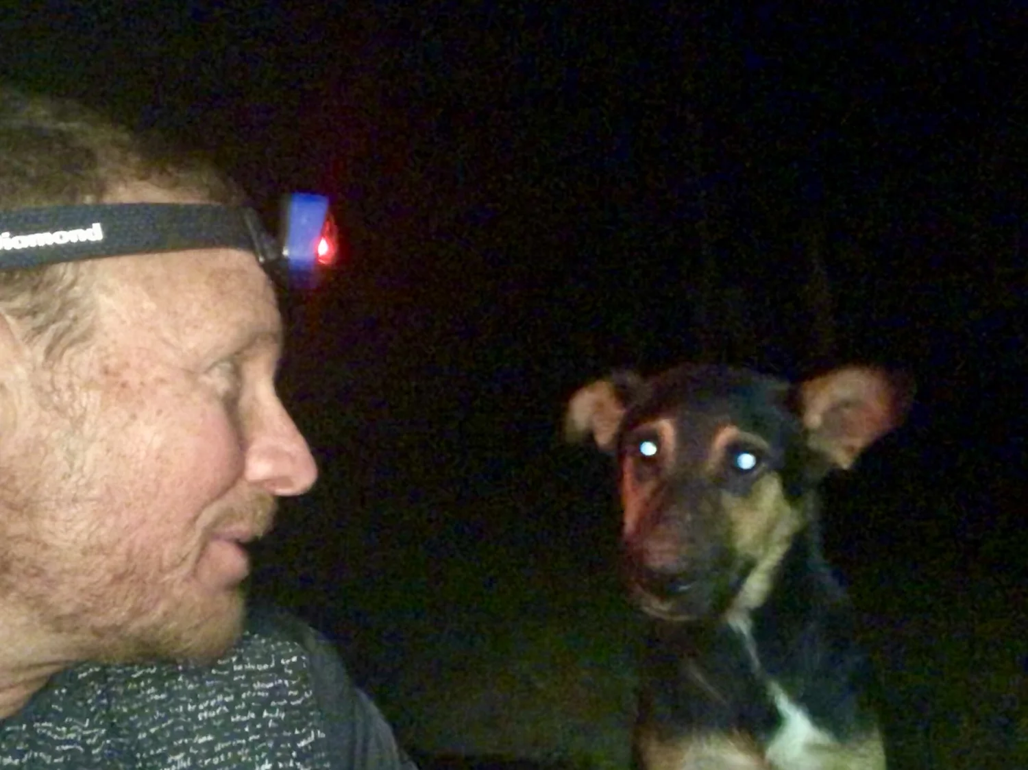 David Green and Lucky together at night on the trail in Brazil