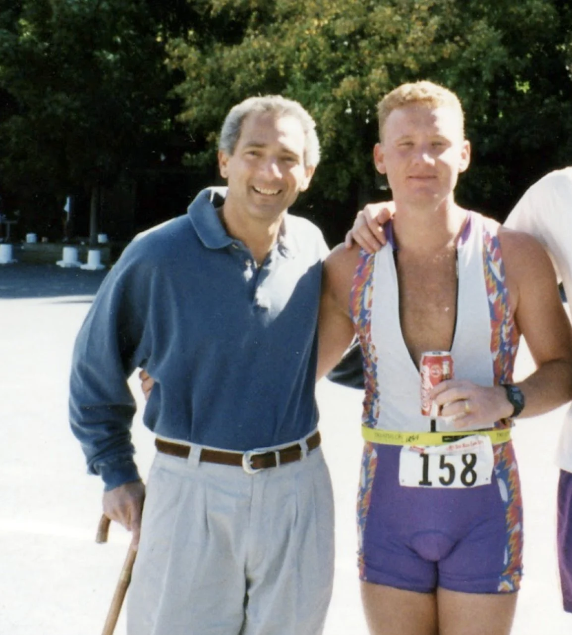 David Green in a triathlon suit with his Uncle Walter, who is holding a cane, after the finish of the Josh Billings triathlon in 1994.