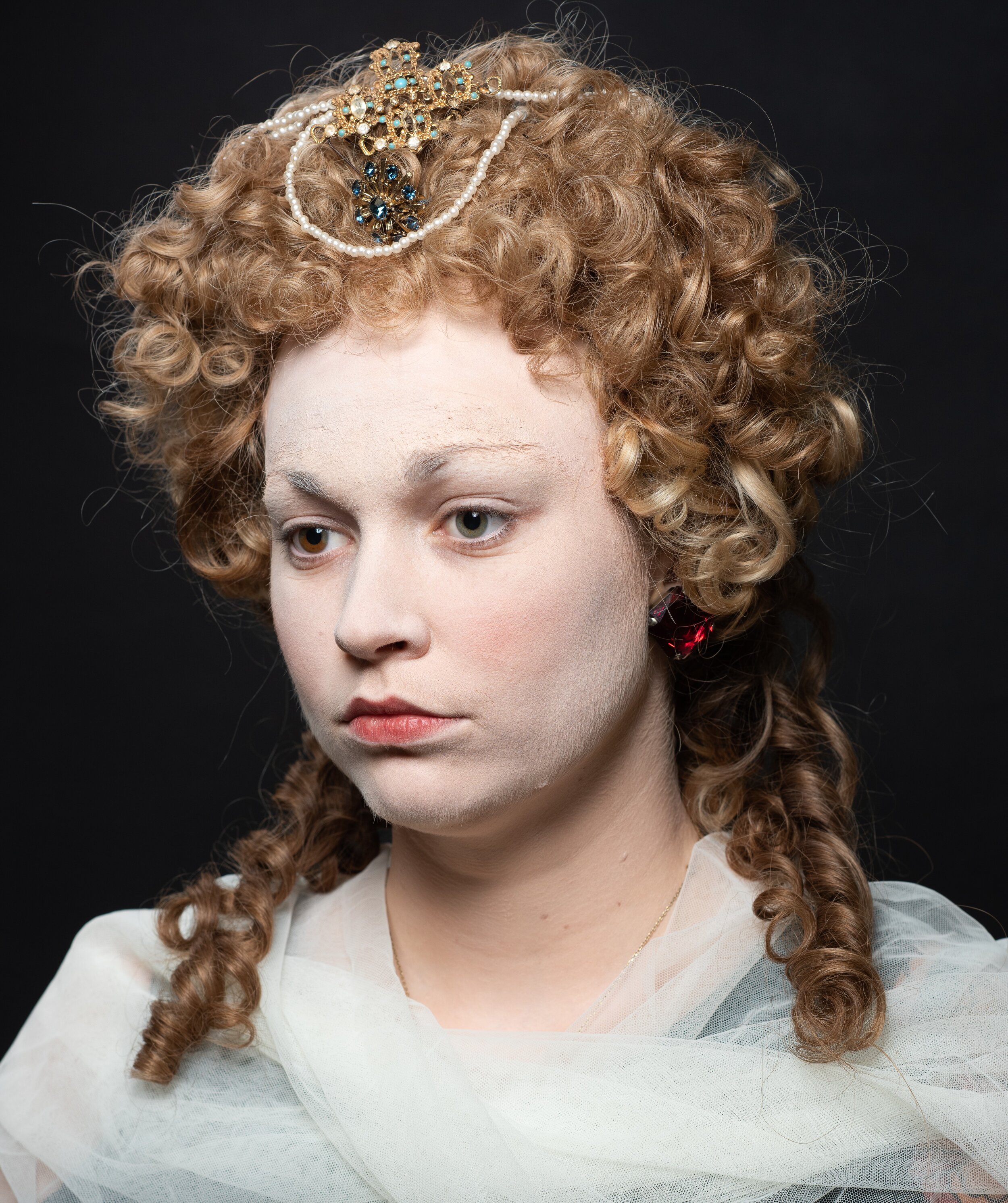 Elizabethan wig and make-up with partial bald cap to create the high hairline. Wig was pre-dressed for me.