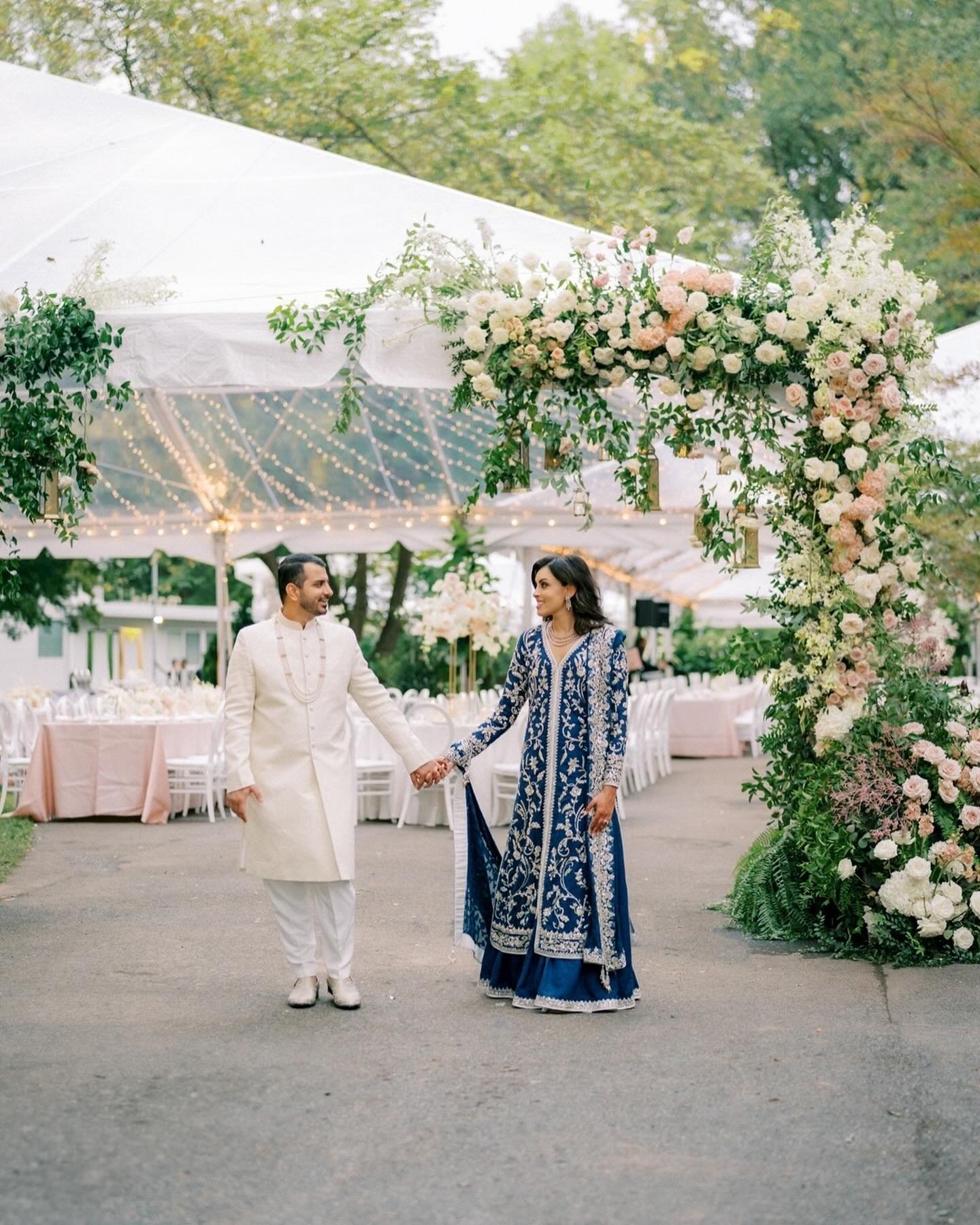 Day 2:  S+N&rsquo;s wedding design was the timeless elegance of blush and white hues, blossoming under a canopy of twinkling lights. The tent was adorned with breathtaking floral installations, each one a wow factor sure to leave guests breathless. 
