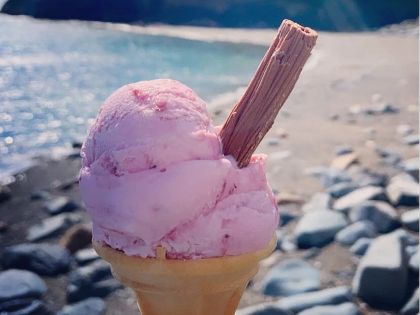 Strawberry ice cream with a flake on Criccieth beach from Cadwaladers