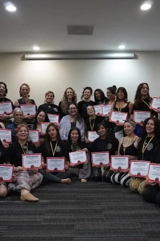 Graduates holding their FatChanceBellyDance® certificates